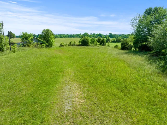 a view of a lake with a yard