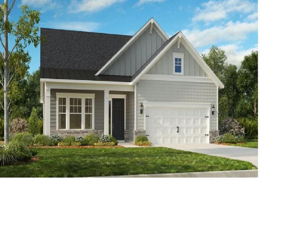 17138 Sand Bank Road, Unit 381 Charlotte, NC 28278 - Photo 1 of 8 a front view of a house with a garden