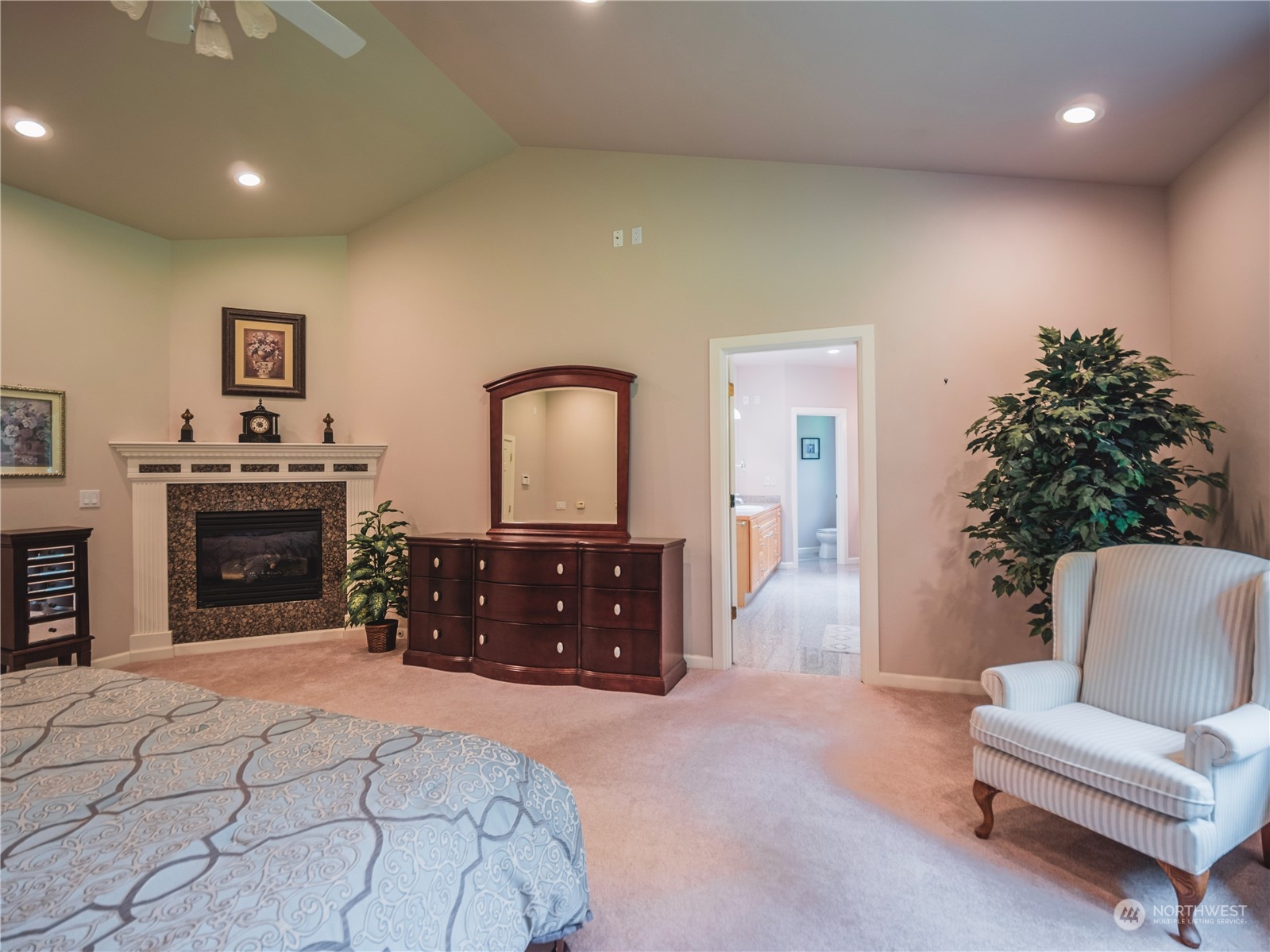 7801 Westlund Road Arlington, WA 98223 - Photo 11 of 39 a spacious bedroom with a bed and a couch