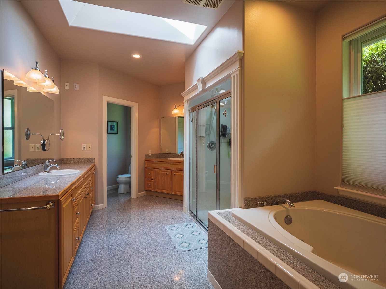 7801 Westlund Road Arlington, WA 98223 - Photo 13 of 39 a bathroom with a tub sink and mirror