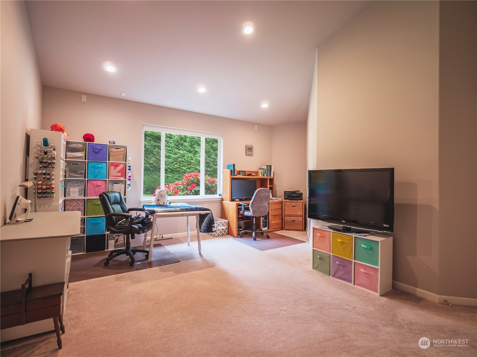 7801 Westlund Road Arlington, WA 98223 - Photo 19 of 39 a living room with furniture and a flat screen tv
