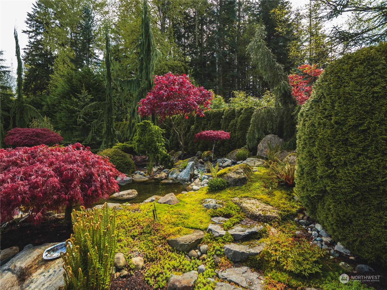 7801 Westlund Road Arlington, WA 98223 - Photo 24 of 39 a backyard of a house with yard