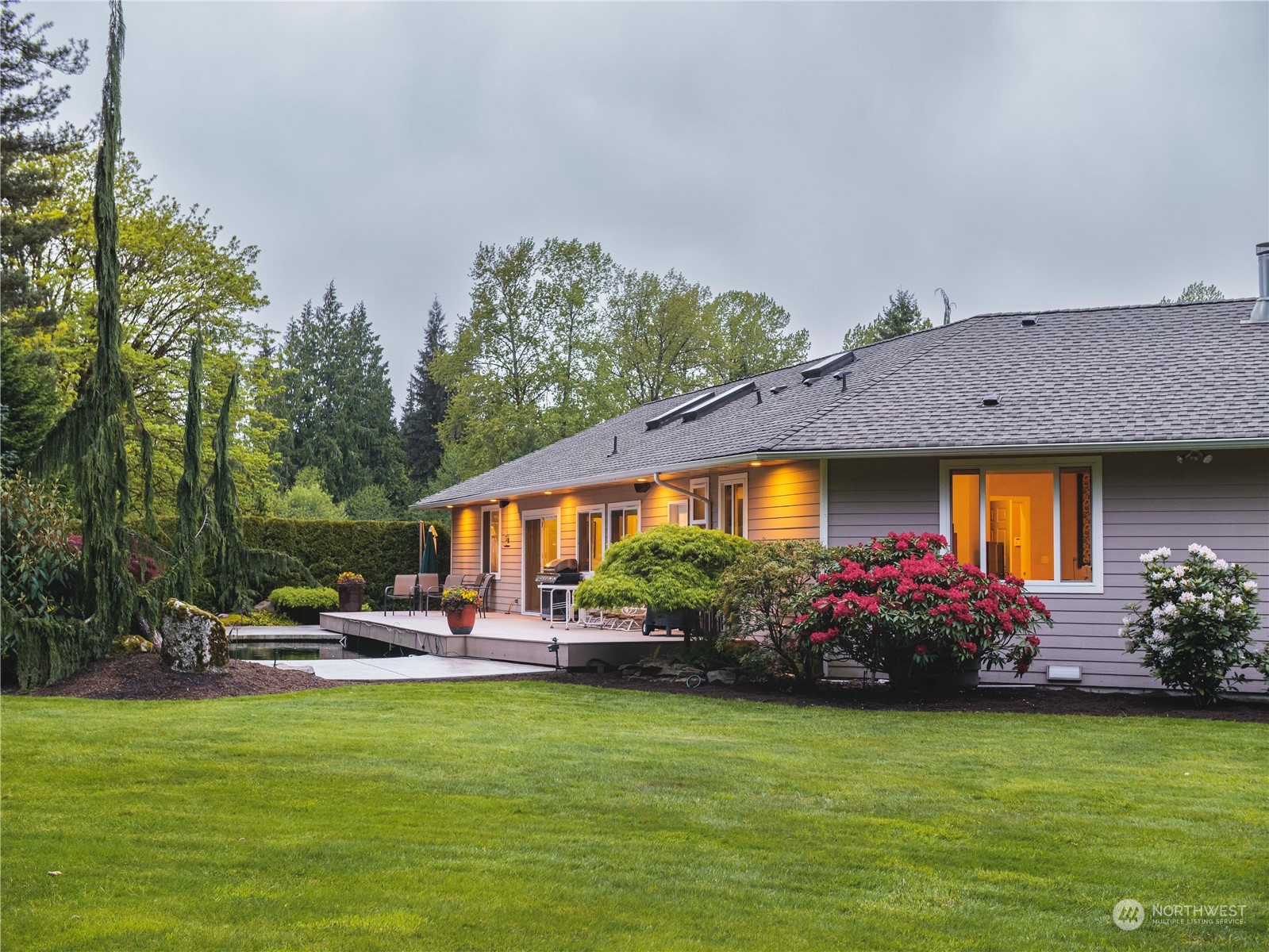7801 Westlund Road Arlington, WA 98223 - Photo 25 of 39 a front view of house with yard and outdoor seating