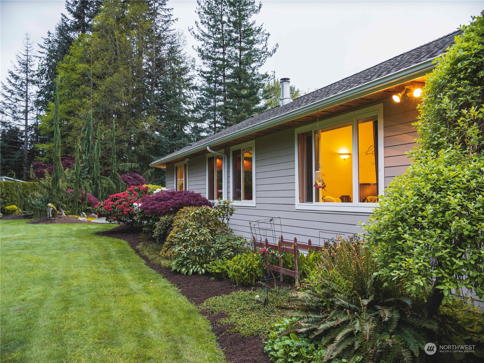 7801 Westlund Road Arlington, WA 98223 - Photo 30 of 39 a front view of house with yard and trees