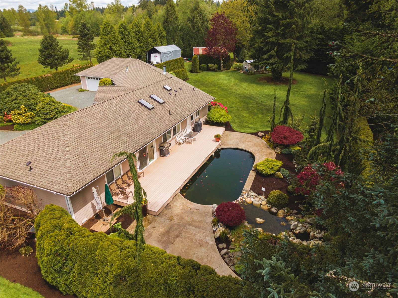 7801 Westlund Road Arlington, WA 98223 - Photo 36 of 39 an aerial view of a house with yard swimming pool and outdoor seating