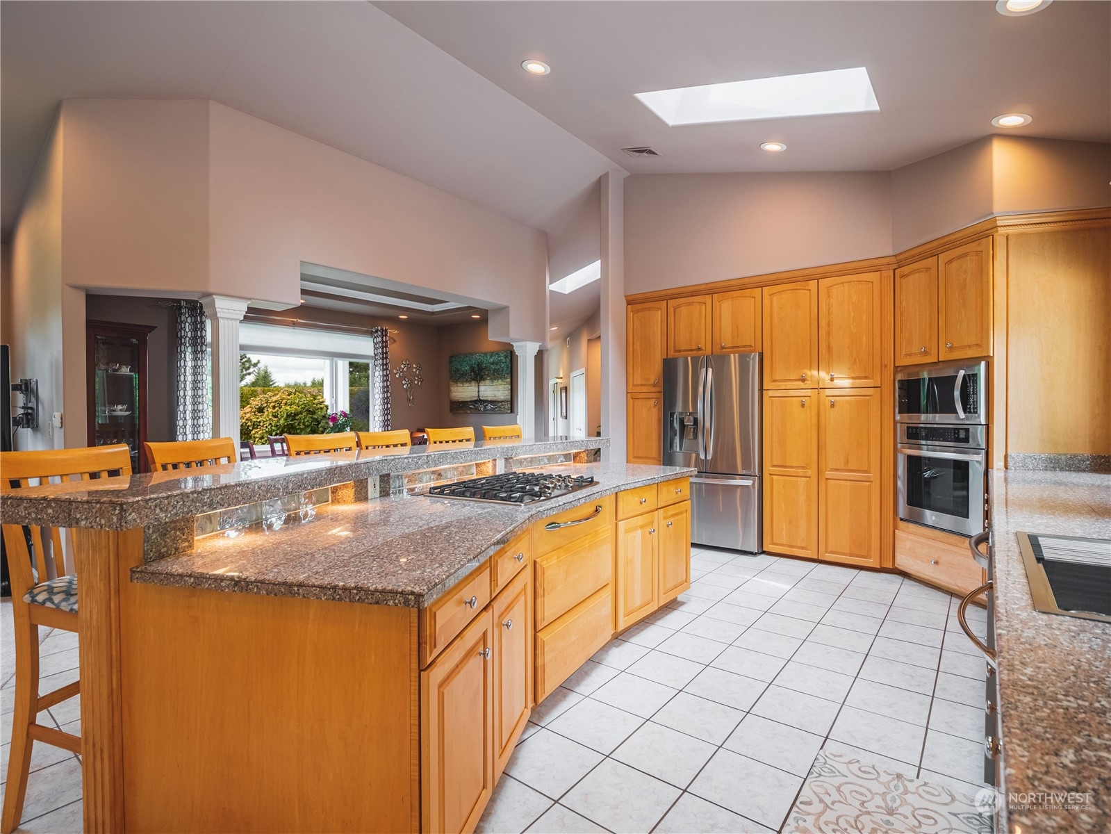 7801 Westlund Road Arlington, WA 98223 - Photo 5 of 39 a kitchen with stainless steel appliances granite countertop a sink and a refrigerator