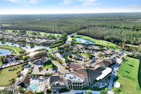 an aerial view of residential houses with outdoor space and street view
