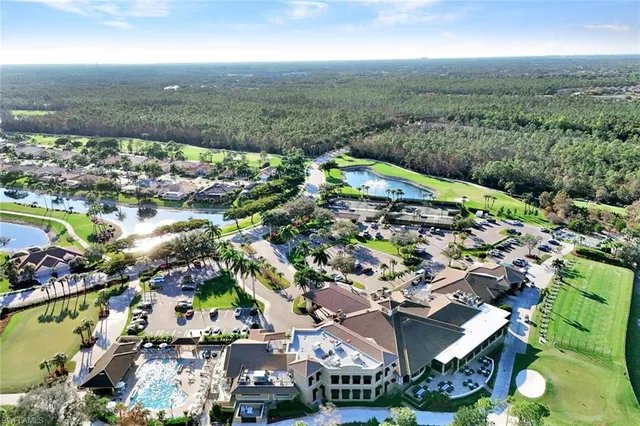 an aerial view of residential houses with outdoor space and street view