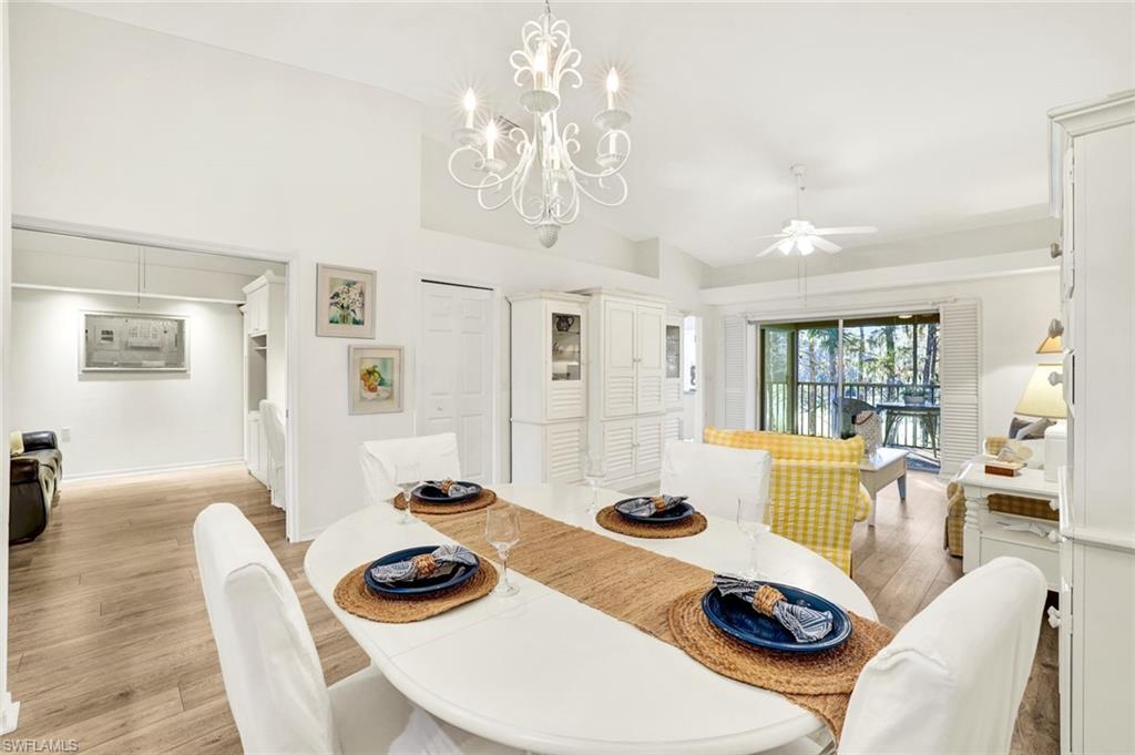 3715 Buttonwood Way, Unit 1722 Naples, FL 34112 - Photo 3 of 29 a living room with furniture and a table