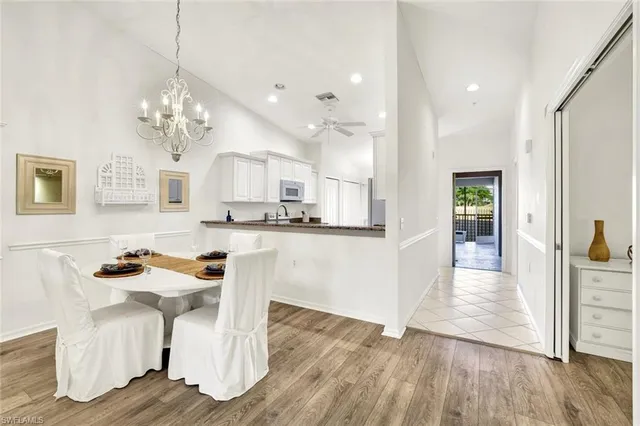 a view of kitchen with furniture and wooden floor