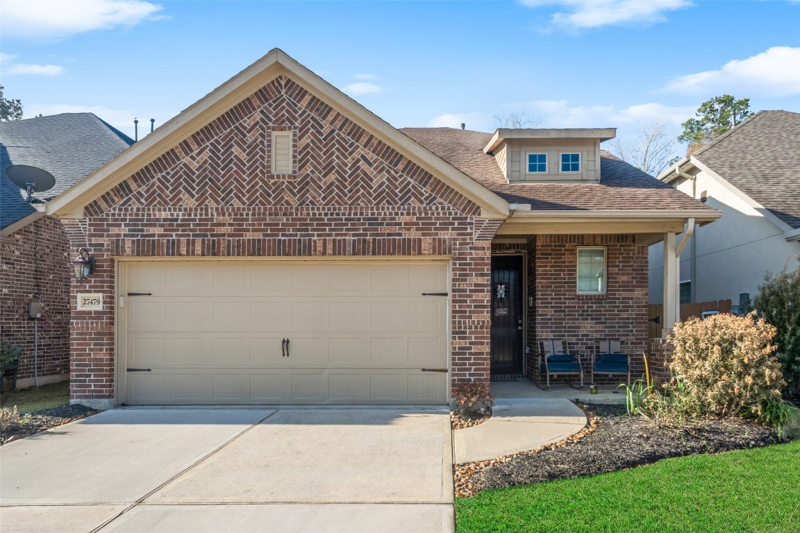 27479 Vivace Drive Spring, TX 77386 - Photo 1 of 25 a front view of a house with a garden