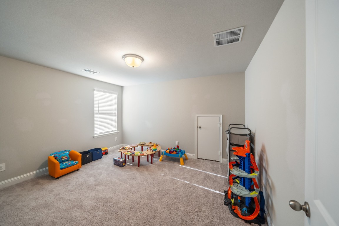 27479 Vivace Drive Spring, TX 77386 - Photo 14 of 25 a bedroom with bed and a window