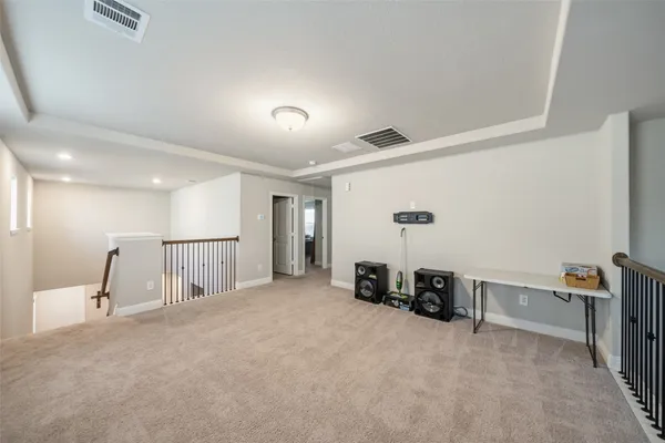 a view of a livingroom with furniture and a flat screen tv