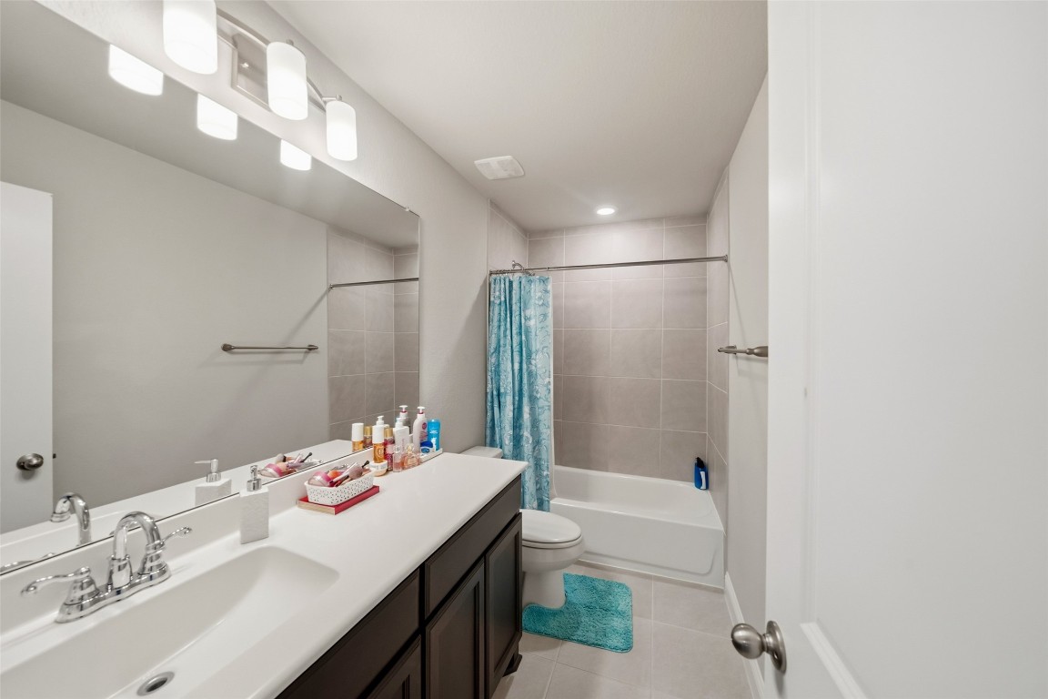 27479 Vivace Drive Spring, TX 77386 - Photo 20 of 25 a bathroom with a tub sink and mirror