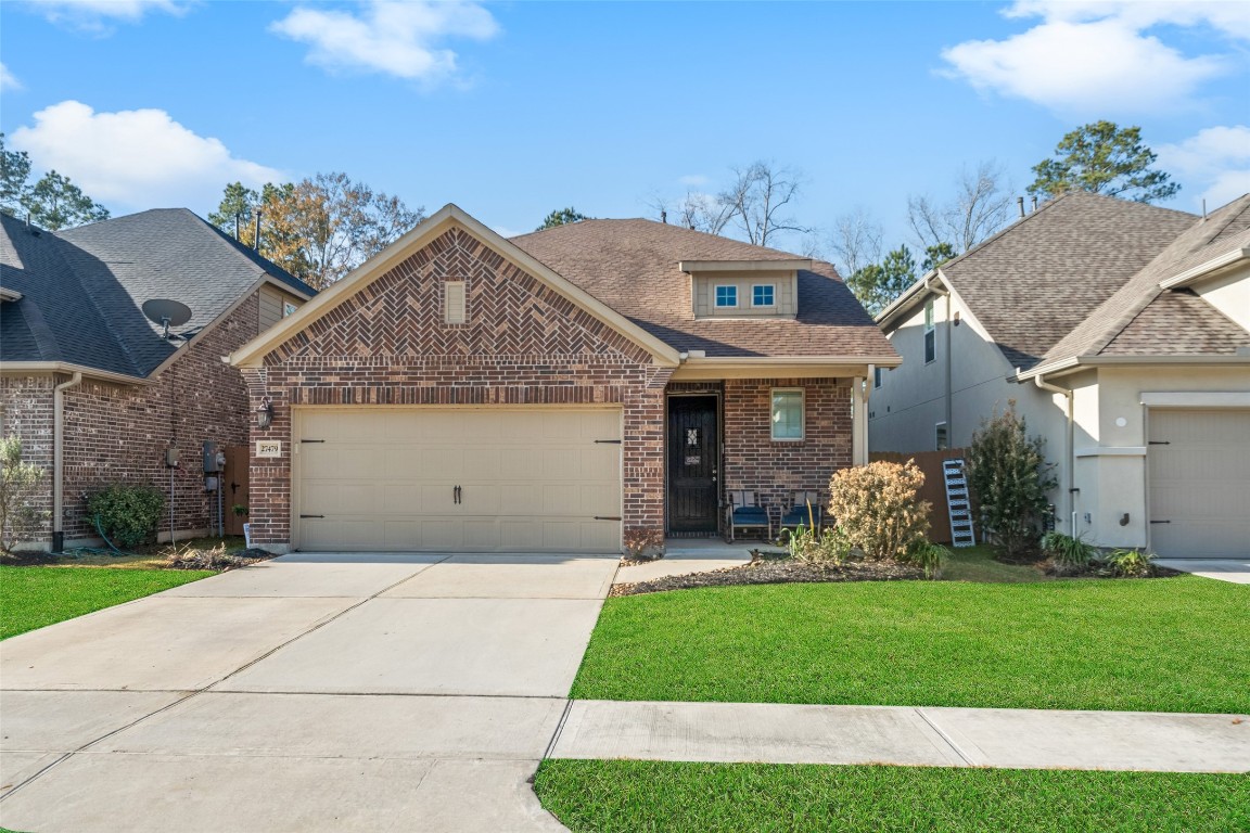 27479 Vivace Drive Spring, TX 77386 - Photo 2 of 25 a front view of a house with a garden and plants