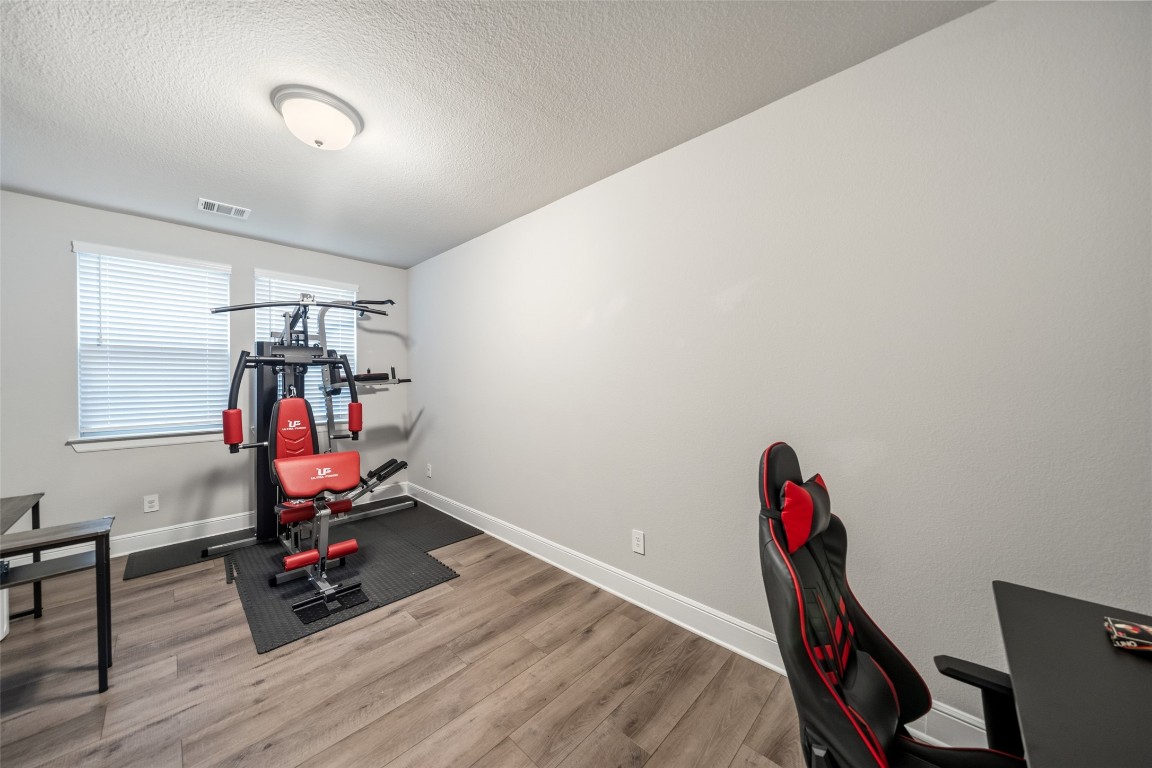 27479 Vivace Drive Spring, TX 77386 - Photo 21 of 25 a view of a room with gym equipment