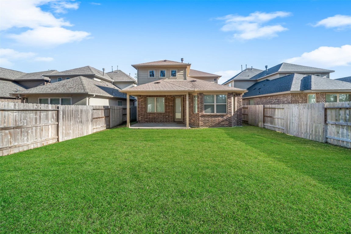 27479 Vivace Drive Spring, TX 77386 - Photo 24 of 25 a view of a house with a yard and sitting area