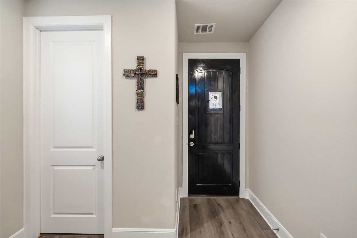 27479 Vivace Drive Spring, TX 77386 - Photo 4 of 25 a view of a hallway with wooden floor