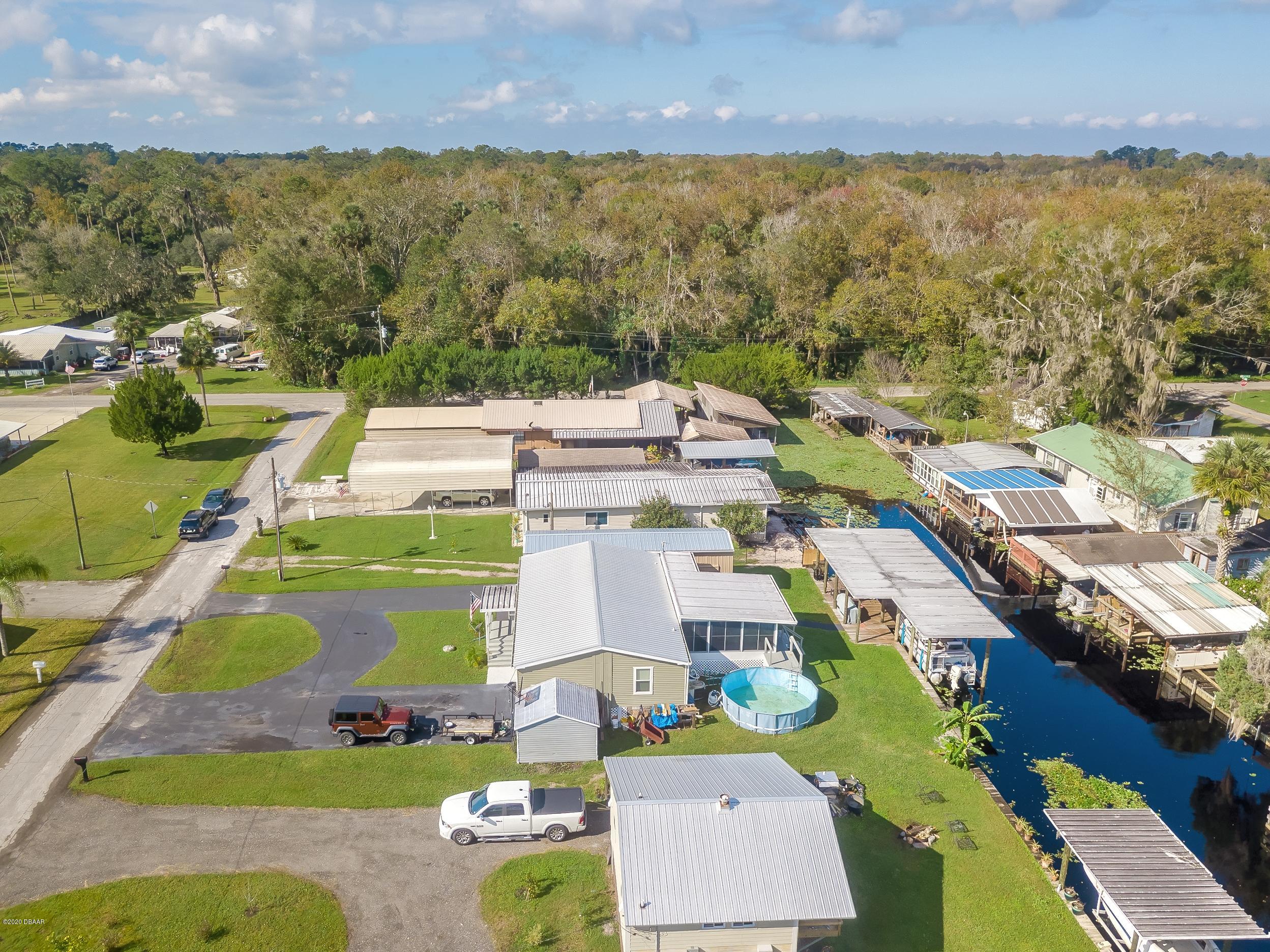 24513 Snail Road Astor, FL 32102 - Photo 36 of 40 an aerial view of residential houses with outdoor space and ocean view