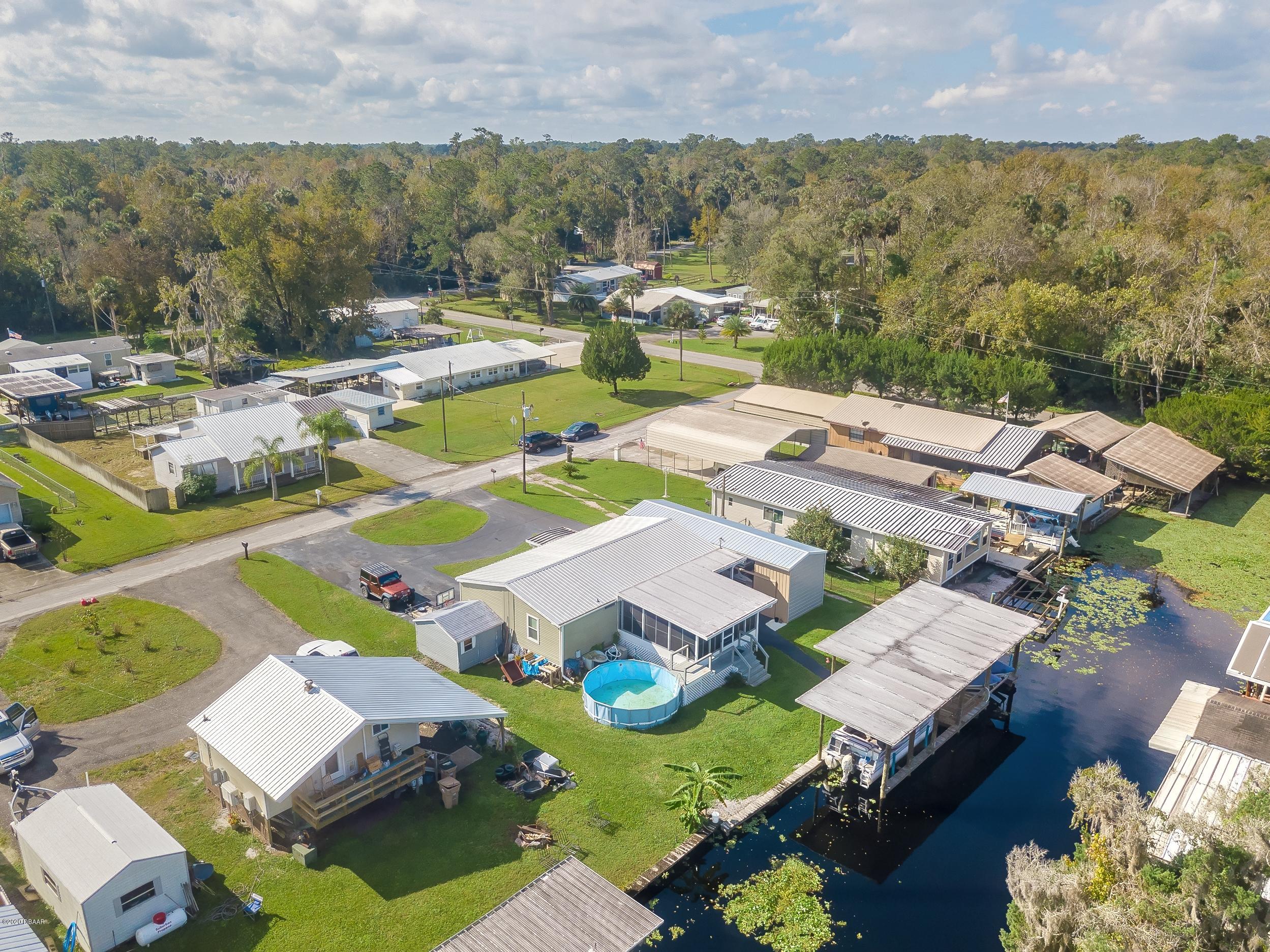 24513 Snail Road Astor, FL 32102 - Photo 37 of 40 an aerial view of residential houses with outdoor space