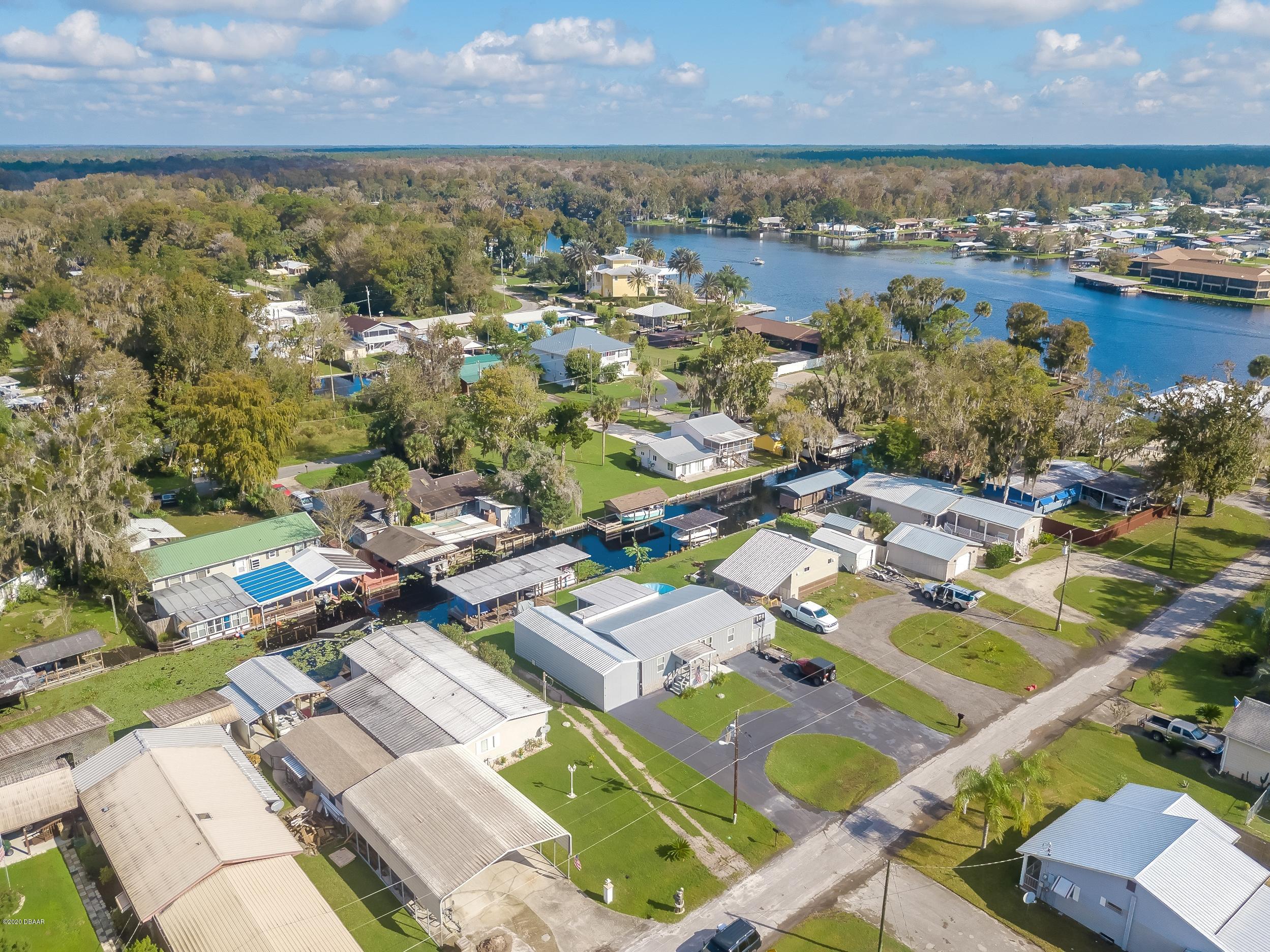 24513 Snail Road Astor, FL 32102 - Photo 40 of 40 an aerial view of residential houses with outdoor space