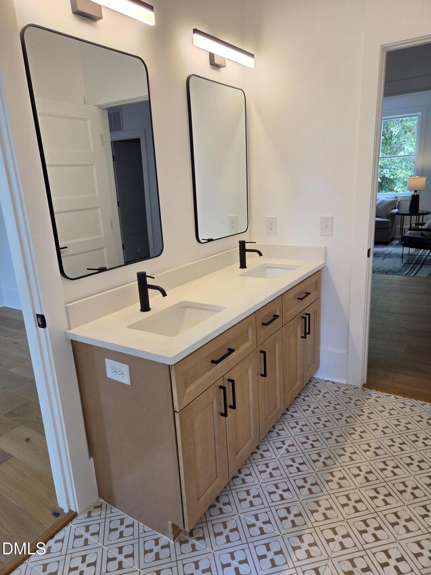 712 Van Buren Road Raleigh, NC 27604 - Photo 27 of 34 a bathroom with a sink and a mirror