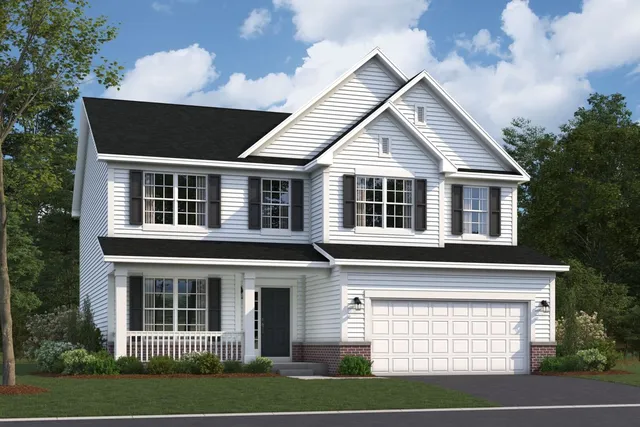 a view of a house with a yard and potted plants