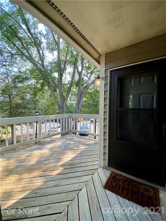 1604 Sharon Road West Charlotte, NC 28210 - Photo 2 of 15 a view of a balcony with wooden floor