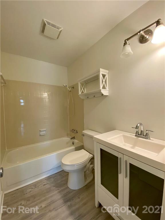 1604 Sharon Road West Charlotte, NC 28210 - Photo 13 of 15 a bathroom with a sink a toilet and shower