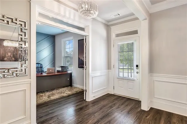 a view of a hallway view with wooden floor and staircase
