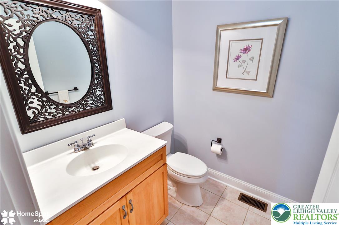 5500 Ayers Road Easton, PA 18040 - Photo 13 of 56 a bathroom with a toilet a sink and a mirror