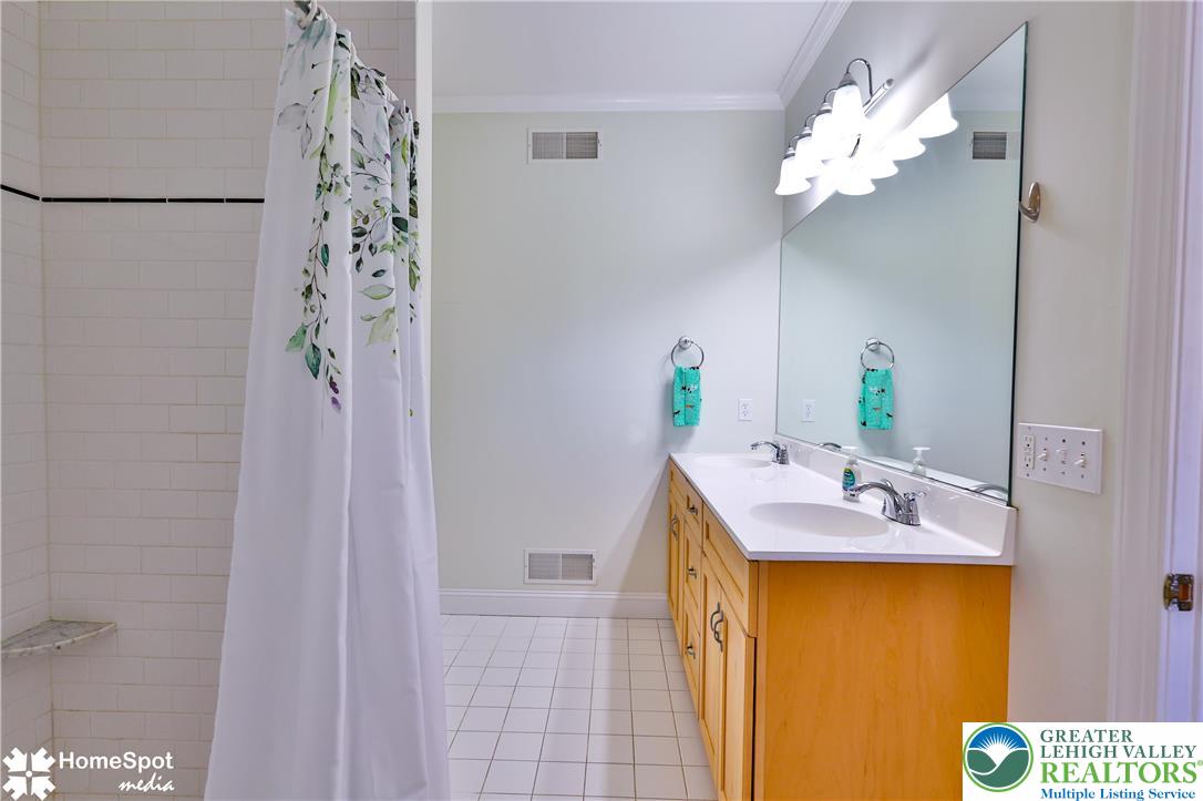 5500 Ayers Road Easton, PA 18040 - Photo 17 of 56 a bathroom with a sink mirror and vanity
