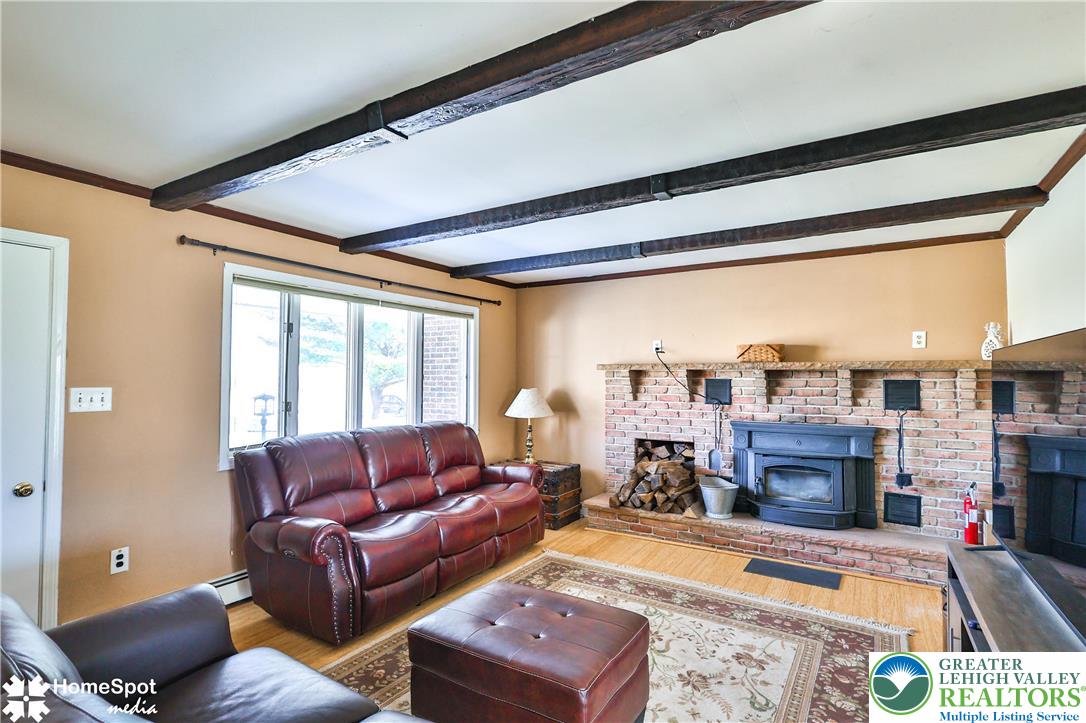 5500 Ayers Road Easton, PA 18040 - Photo 19 of 56 a living room with furniture a fireplace and a flat screen tv