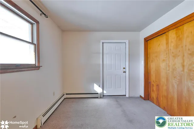 a view of storage and utility room with washer and dryer