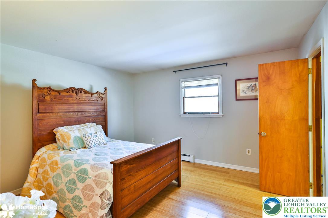 5500 Ayers Road Easton, PA 18040 - Photo 24 of 56 a bedroom with a bed and wooden floor