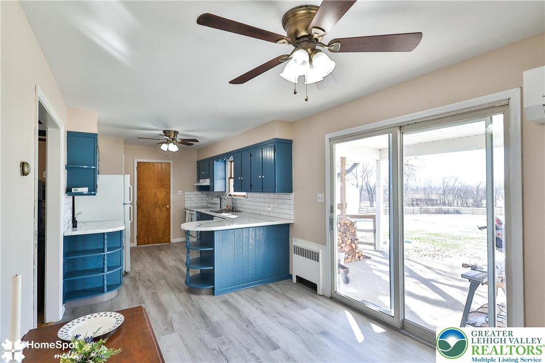 5500 Ayers Road Easton, PA 18040 - Photo 28 of 56 a large kitchen with stainless steel appliances granite countertop a stove and a view of living room
