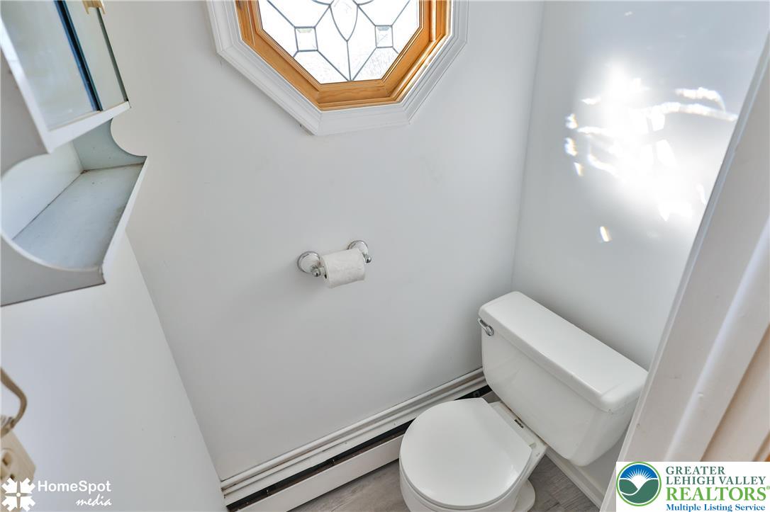 5500 Ayers Road Easton, PA 18040 - Photo 33 of 56 a white toilet sitting next to a white cabinet