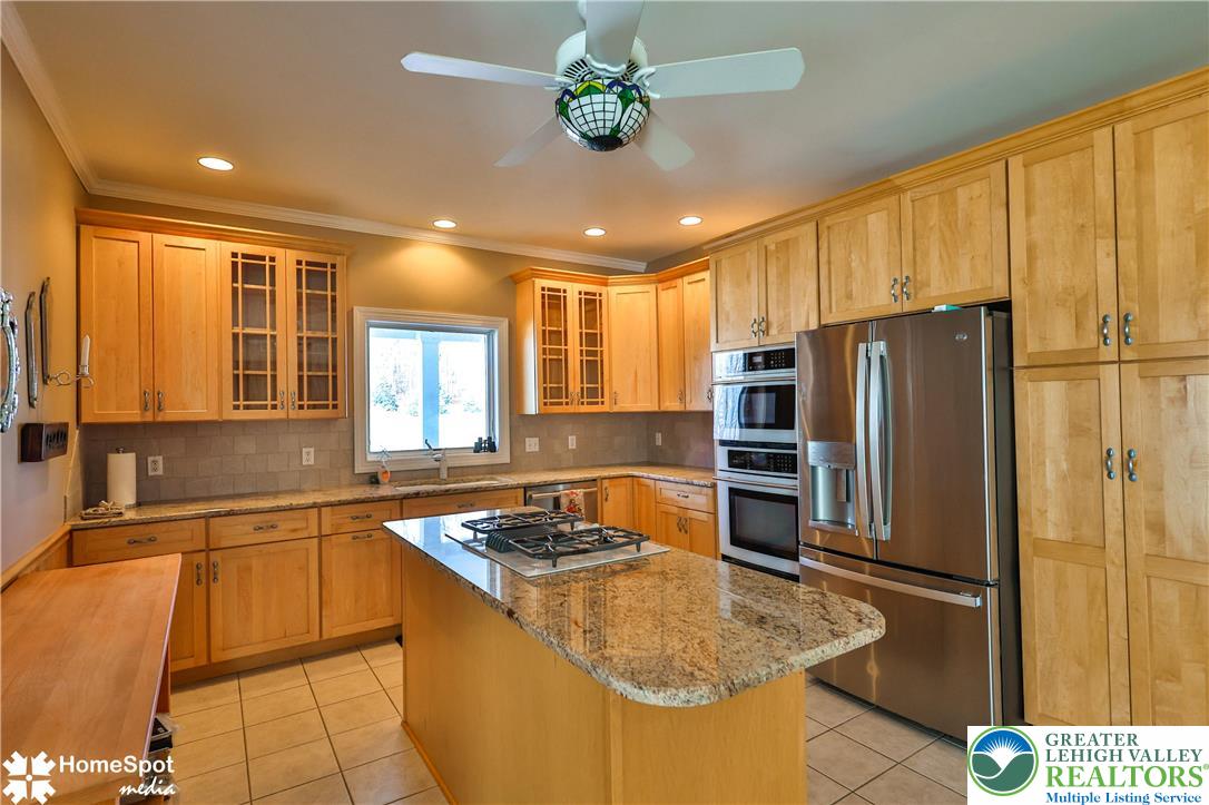 5500 Ayers Road Easton, PA 18040 - Photo 6 of 56 a kitchen with stainless steel appliances granite countertop a sink refrigerator and cabinets