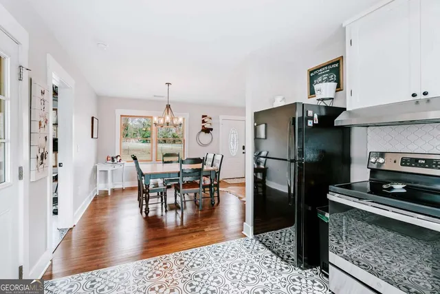 an aerial view of a front of a door and a white stove