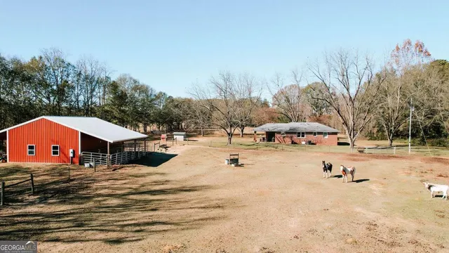 a view of outdoor space with swimming pool and trees