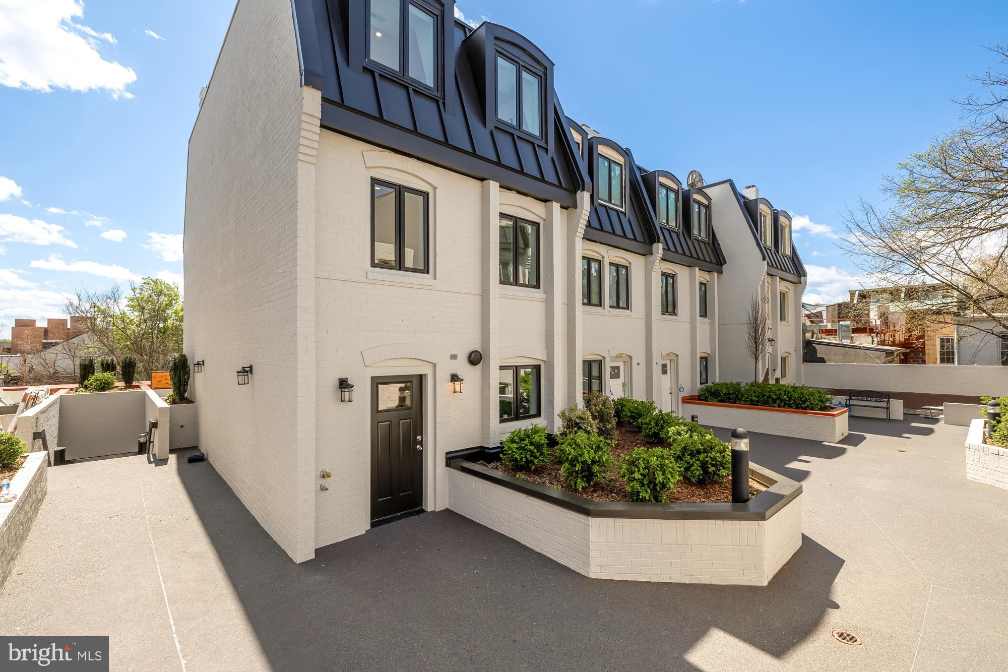 1200 Potomac Street Northwest, Unit T5 Washington, DC 20007 - Photo 1 of 6 a view of a house with backyard and sitting area