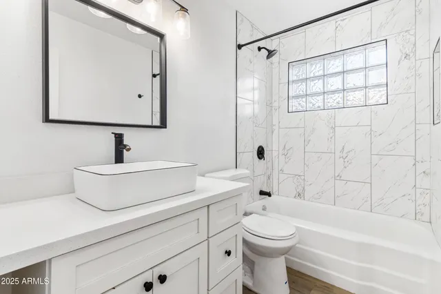 a kitchen with a refrigerator and a stove