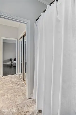 a view of a bedroom from a hallway