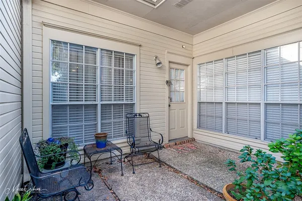 a backyard of a house with outdoor seating