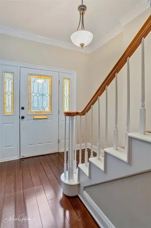a view of an entryway with wooden floor