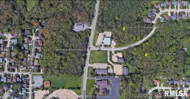 an aerial view of houses with outdoor space