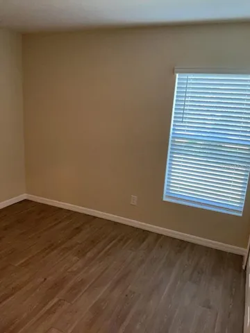 a view of front door with wooden floor