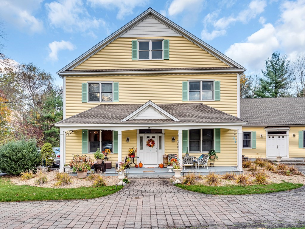 168 Proctor Road Chelmsford, MA 01824 - Photo 1 of 41 a front view of a house with outdoor seating yard and outdoor seating