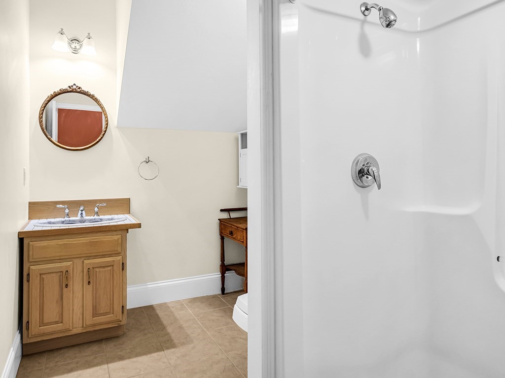 168 Proctor Road Chelmsford, MA 01824 - Photo 36 of 41 a bathroom with a granite countertop sink and a mirror