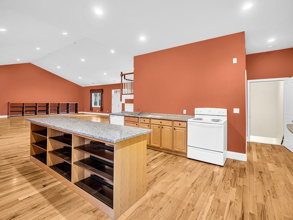 168 Proctor Road Chelmsford, MA 01824 - Photo 5 of 41 a kitchen with stainless steel appliances granite countertop a stove and a sink